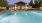 a clubhouse with a pool