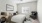 a bedroom with a bed and a chair