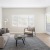 a living room with a tv and couches