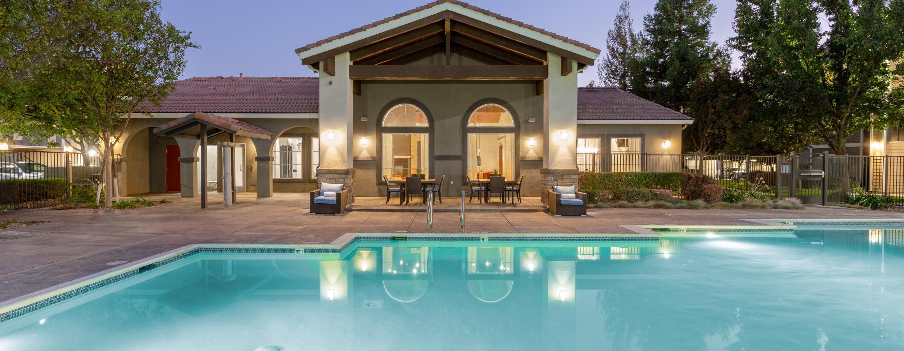a clubhouse with a pool