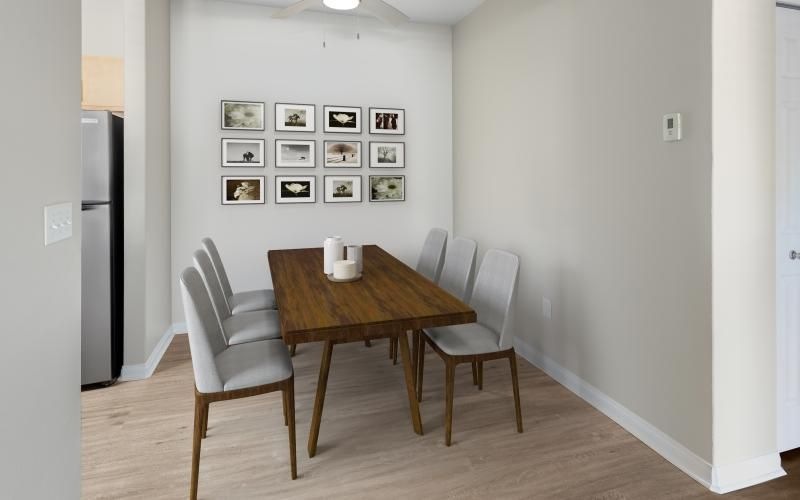 a dining room table with chairs