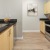 a kitchen with wooden cabinets